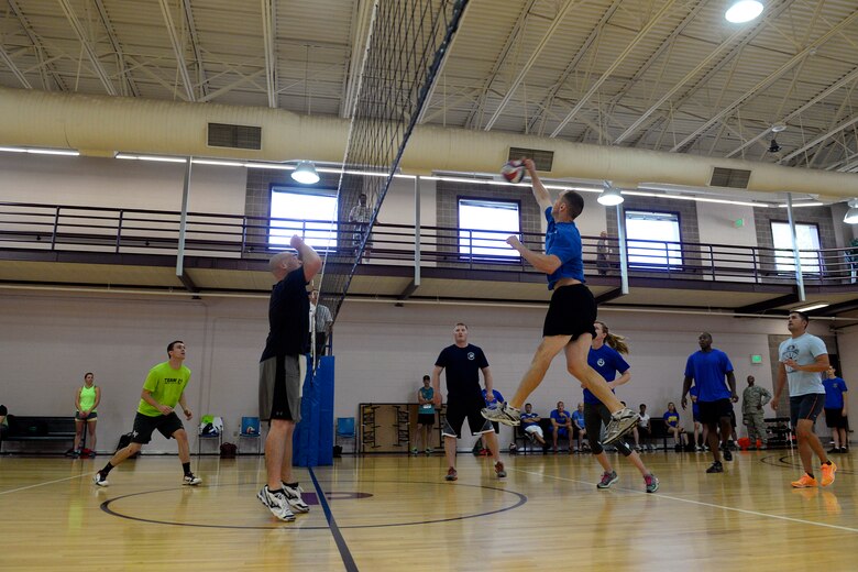 A Team Schriever member jumps for the volleyball during the first annual Tri-Wing Sports Day Challenge Aug. 28, Peterson Air Force Base, Colo. The 50th Space Wing won placed second in the volleyball tournament. (U.S. Air Force Photo/Christopher DeWitt)
