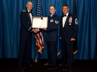 VANCE AIR FORCE BASE, Okla. –Tech. Sgt. Nicholas Barr, the 71st Communications Flight chief contracting officer, receives set of master sergeant stripes with his line number from Col. Clark Quinn, the 71st Flying Training Wing commander, and Chief Master Sgt. Peter Speen, the 71st FTW Command Chief, Aug. 28 during a Senior NCO-Recognition Ceremony at the Vance Collocated Club. (U.S. Air Force photo/Staff Sgt. James Bolinger)