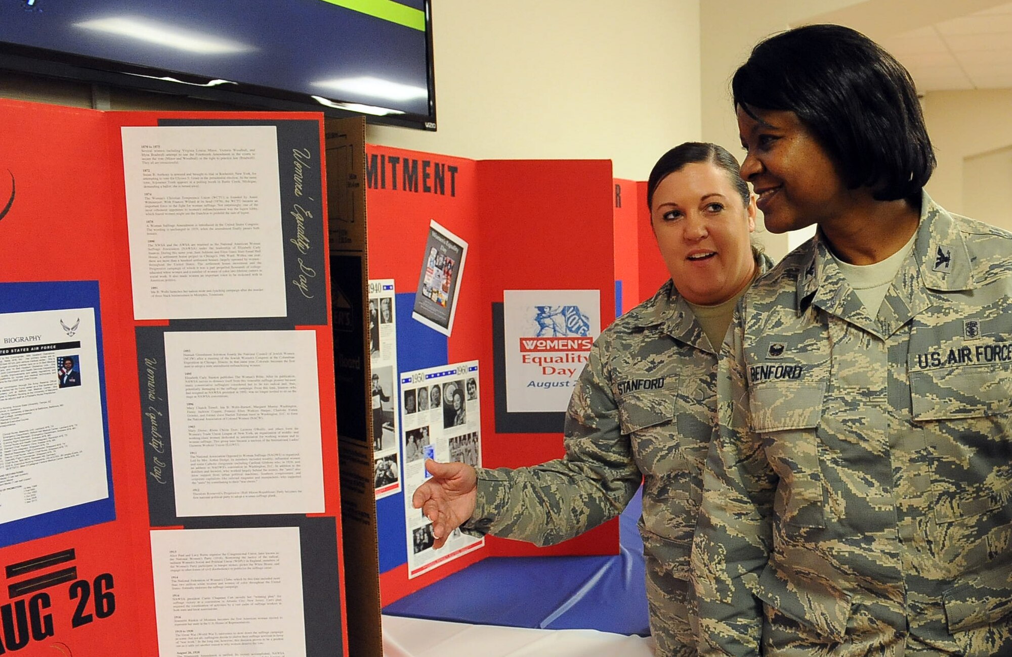 Col. Kirsten Benford (right), 99th Inpatient Operations Squadron commander talks with Tech. Sgt. Ann Stanford, NCO in charge of the 99th Medical Operations Squadron Family Medicine Residency about the importance of Women’s Equality Day. Women’s Equality Day is observed Aug. 26 annually to commemorate the passage of the 19th Amendment to the Constitution.  (U.S. Air Force photo by Airman 1st Class Rachel Loftis)