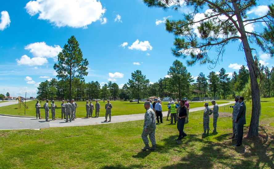 Members of Team Moody wait for the start of a military service station groundbreaking ceremony at Moody Air Force Base, Ga., Sept. 3, 2014. The new addition will increase the 23d Logistics Readiness Squadron’s efficiency and capabilities by offering four grades of ground fuel instead of two. (U.S. Air Force photo by Airman 1st Class Ceaira Tinsley/Released)