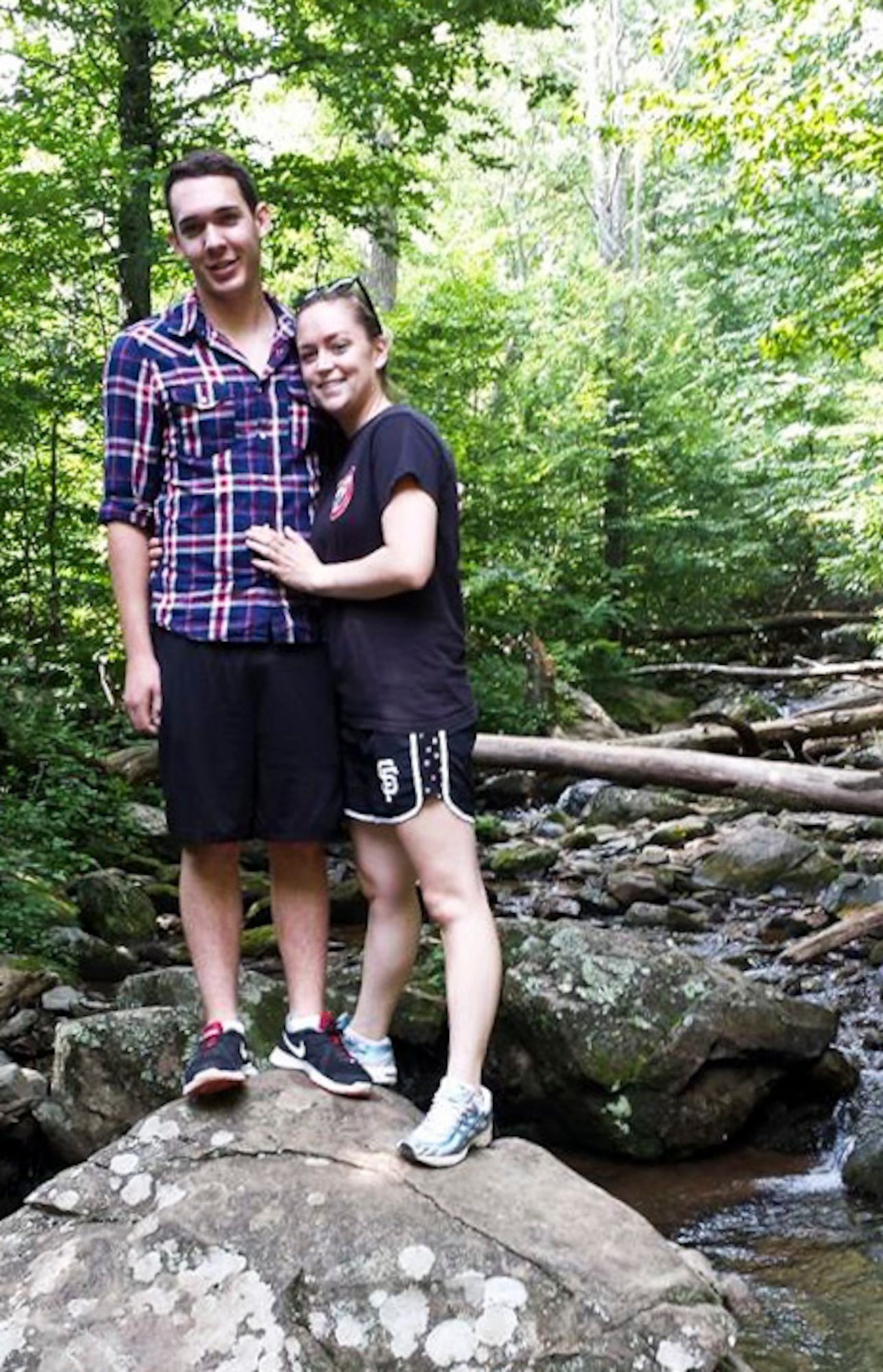 Airman 1st Class Andrew Pranzo, 89th Communications Squadron airborne communications technician, and Airman Katherine Rovegno, 79th Medical Wing outpatient records technician, pose for a photo during a hike at Shenandoah National Park, Va., Aug. 10. Later that day, a Virginia man fell about four feet and smash his head on a boulder. Assisted by Tech. Sgt. Jeffery Boyette and Karen Boyette, Pranzo treated a Y-shaped gash in the man’s forehead using Pranzo’s shoelace and a pair of shorts from a small child’s diaper bag. Pranzo then helped the man walk two miles out of the mountains while carrying his young granddaughter. (Courtesy photo)
