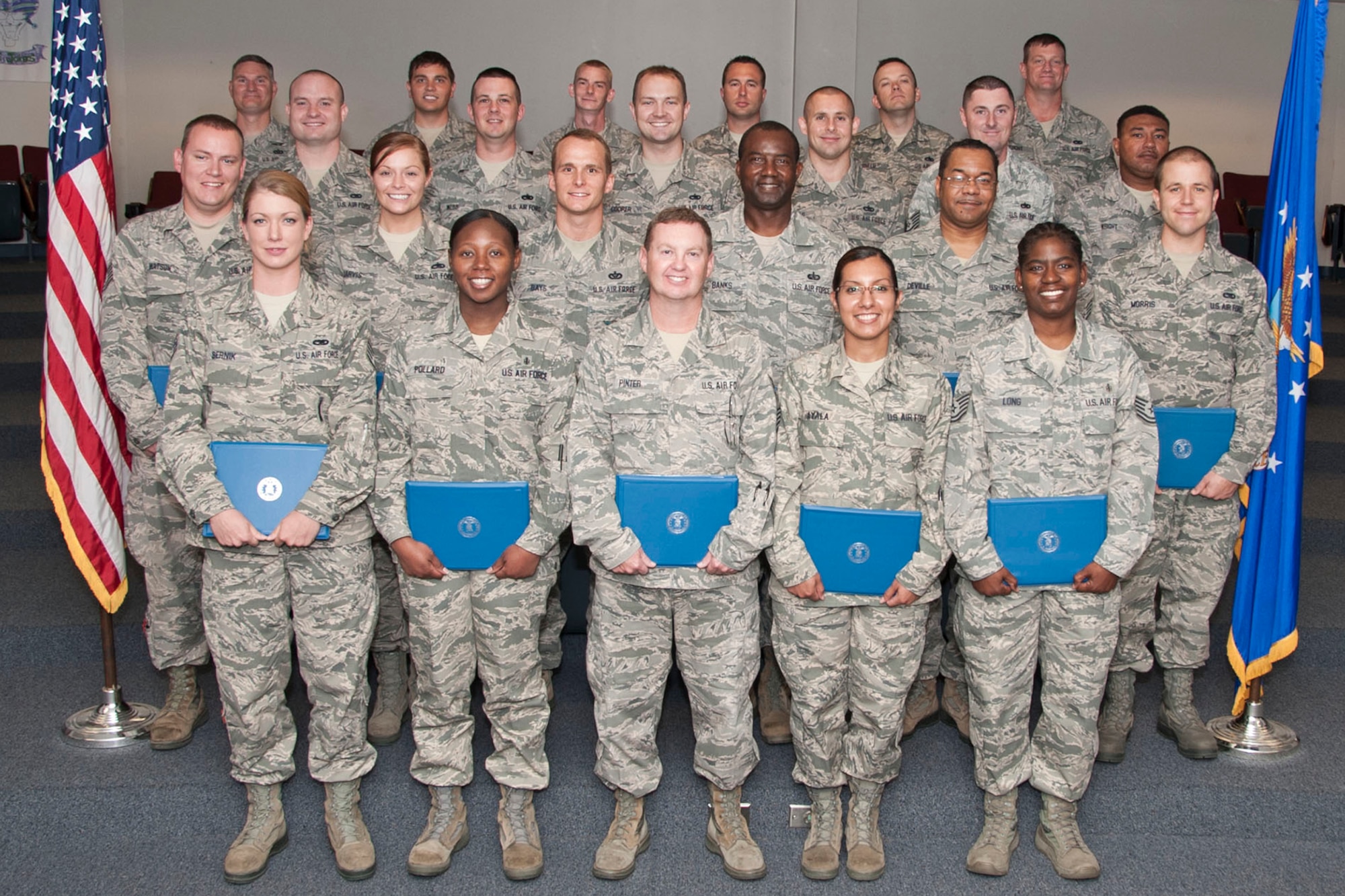 Members of the Non-commissioned Officer Leadership Development Course graduation class of 2014, pose for a group photo Aug. 29, 2014, at Barksdale Air Force Base, La. The course provides mid-level enlisted personnel (E-5 and E-6) with hands on experience in leadership and management. The course focuses on writing performance reports, mentoring and case studies. (U.S. Air Force photo by Master Sgt. Jeff Walston/Released)