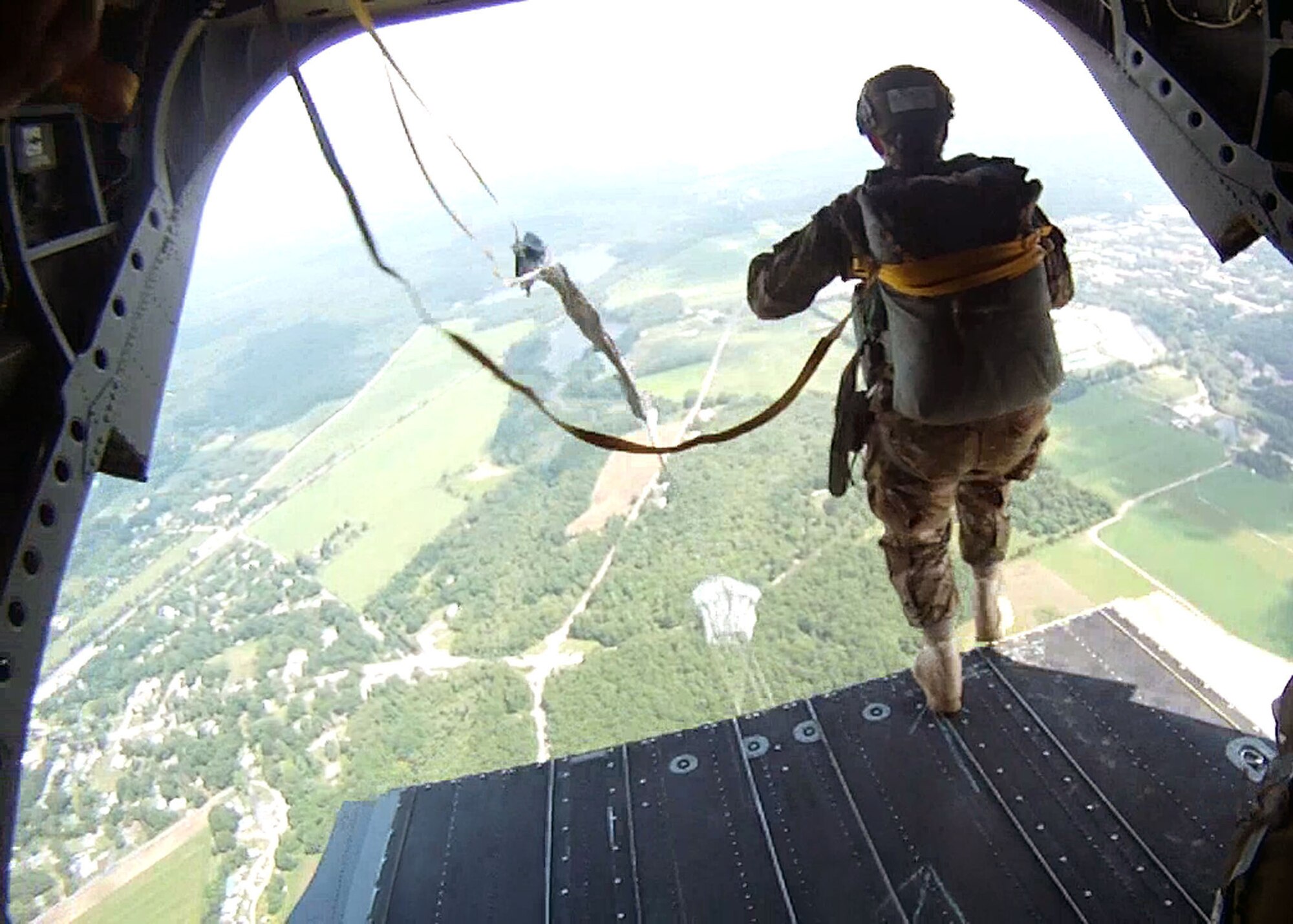 Staff Sgt. Cassandra Napolitano-Romero, a combat weatherman with the 18th Weather Squadron, jumps from a CH-47 Chinook helicopter during the annual Leapfest international static-line parachute competition held at West Kingston, Rhode Island, Aug. 2-4. 18th Air Support Operations Group Leapfest team members Master Sgt. Troy Misiak, Staff Sgt. Cassandra Napolitano-Romero, Tech Sgt. Christopher Allen, all combat weathermen assigned to the 18th Weather Squadron and Master Sgt. Warren Williams, a TACP with the 18th ASOG, finished third place in the event. (Courtesy photo)