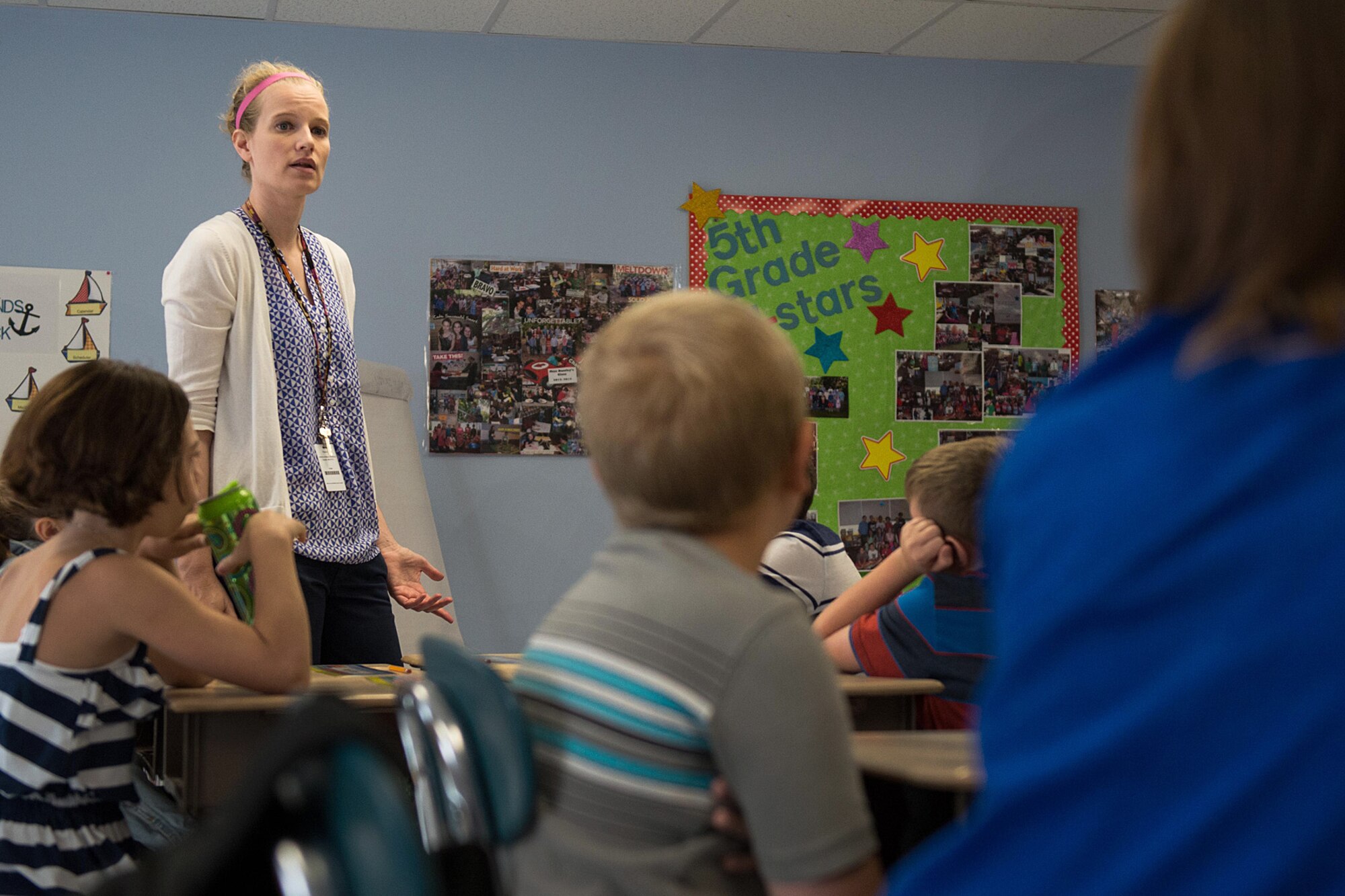 Hanscom Middle School Teacher Sarah Dunfey welcomes fifth grade students on the first day of school inside a temporary facility Sept. 2. Middle School students will be attending classes this year in the temporary facility until the completion of the new middle school in 2016. (U.S. Air Force photo by Mark Herlihy) 