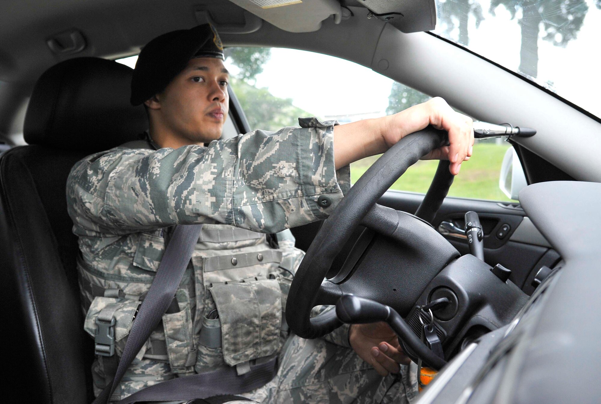 U.S. Air Force Senior Airman William Beasley, 35th Security Forces Squadron base defense operations controller, responds to an accident scene at Misawa Air Base, Japan, Sept. 2, 2014. As a controller, Beasley remains in constant contact with the 35 SFS dispatcher during patrol and reports incidents and information to the base defense operations center. (U.S. Air Force photo by Airman 1st Class Patrick S. Ciccarone) 