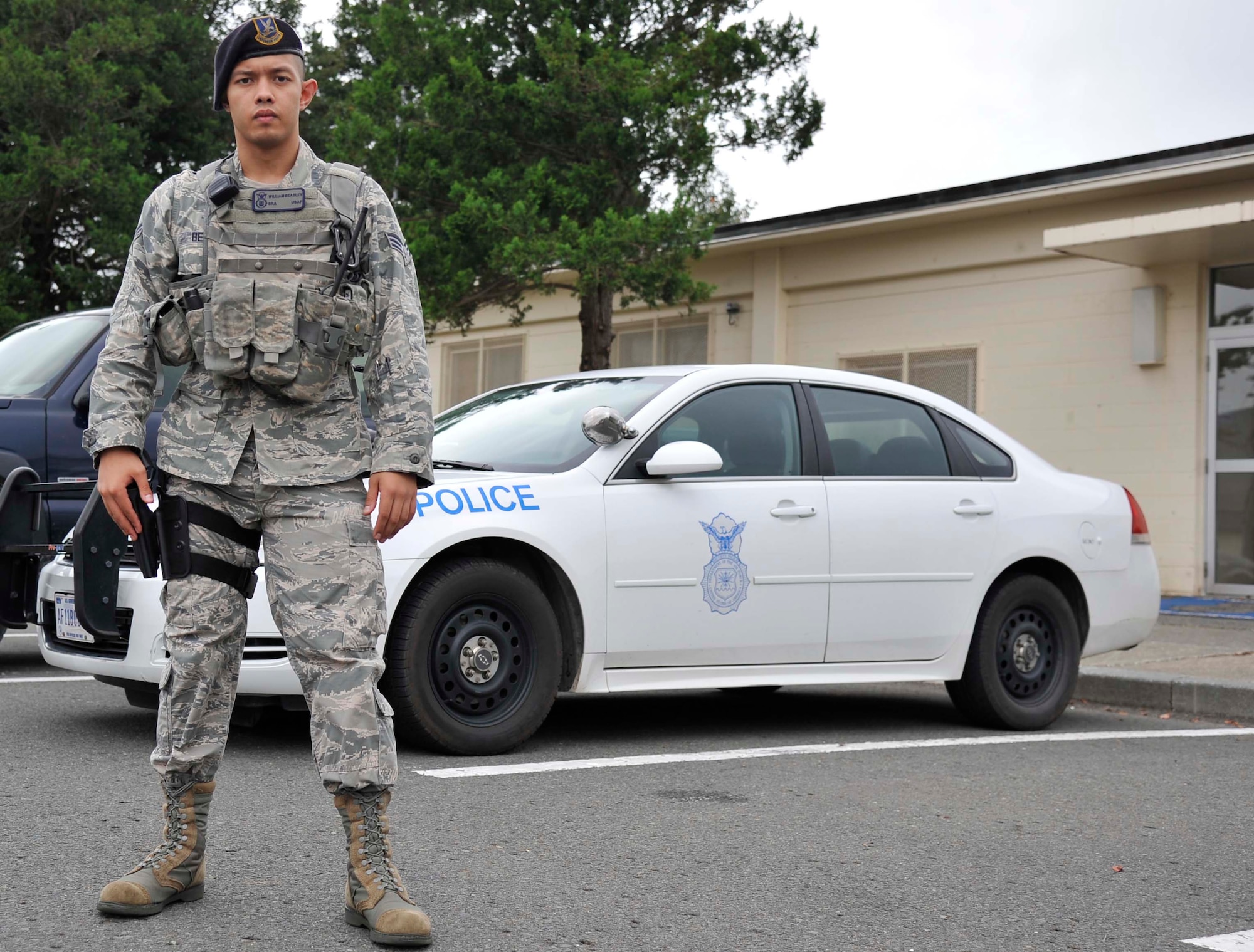 U.S. Air Force Senior Airman William Beasley, 35th Security Forces Squadron base defense operations controller, stands in front of a patrol car at Misawa Air Base, Japan, Sept. 2, 2014. As a security forces patrol officer, Beasley’s responsibilities include responding to accident scenes, dispatching units to an incident and ensuring overall base security. (U.S. Air Force photo by Airman 1st Class Patrick S. Ciccarone/Released)