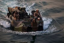 U.S. Marines with Battalion Landing Team 1st Battalion, 6th Marine Regiment, 22nd Marine Expeditionary Unit (MEU), prepare to board the amphibious dock landing ship USS Gunston Hall (LSD 44) in their assault amphibious recovery vehicle after completing sustainment training. The 22nd MEU is deployed with the Bataan Amphibious Ready Group as a theater reserve and crisis response force throughout U.S. Central Command and the U.S. 5th Fleet area of responsibility. (U.S. Marine Corps photo by Sgt. Austin Hazard/Released)