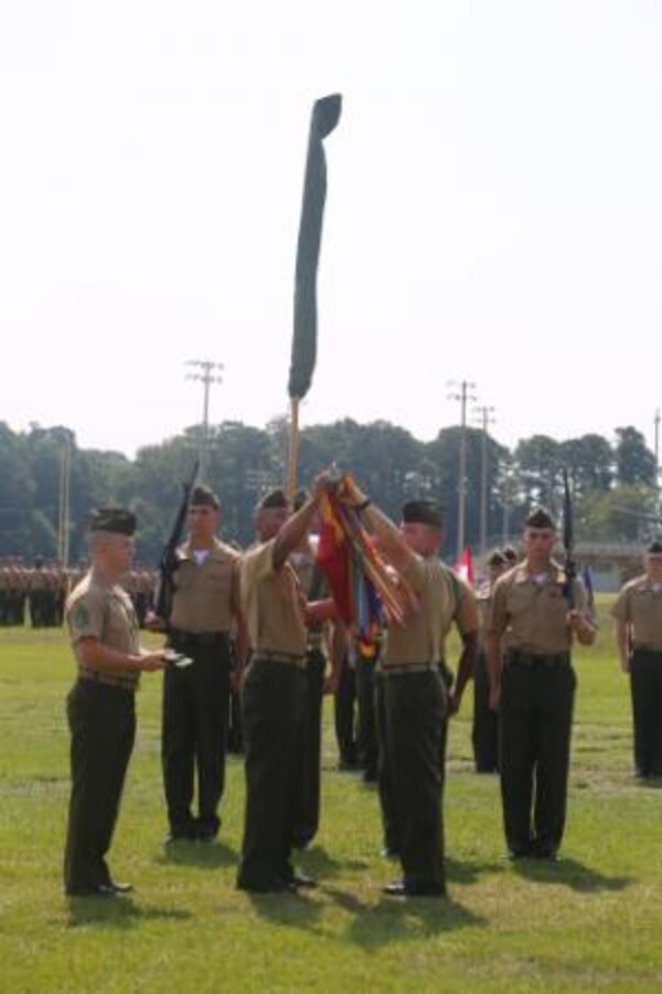 Sergeant Maj. Irvin Howard (center left), the sergeant major of 1st Battalion, 9th Marine Regiment, 2nd Marine Division, and Lt. Col. Corey Collier (center right), the battalion commanding officer, roll and case the battalion’s colors one final time during the unit’s deactivation ceremony aboard Marine Corps Base Camp Lejeune, N.C., Aug. 29, 2014. The colors will be stored at Headquarters Marine Corps until the battalion answer’s the Nation’s call to active service.


