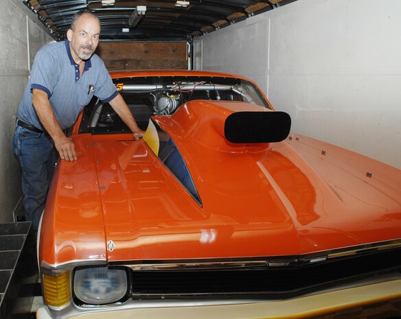 Rex Madding shows off his 1971 Chevy Nova, Outlaw 10.5 drag racing car, with a 565 Big Block Chevy engine he built himself in 2003.