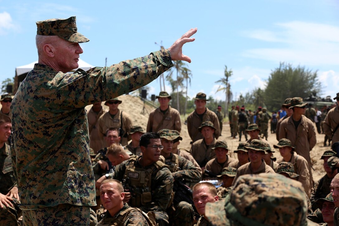 Lt. Gen. John Toolan, commander, U. S. Marine Corps Forces, Pacific, addresses the Marines with the 11th Marine Expeditionary Unit following the culminating joint amphibious demonstration of Malaysia-United States Amphibious Exercise 2014 at Kg Tanduo Beach, Malaysia, Sept. 2. MALUS AMPHEX 14 is a bilateral exercise between the 11th MEU and Malaysian Armed Forces that includes operational and tactical level training in planning, command and control, and combat service support using both ground and sea assets. (U.S. Marine Corps photo by Gunnery Sgt. Rome M. Lazarus/Released)