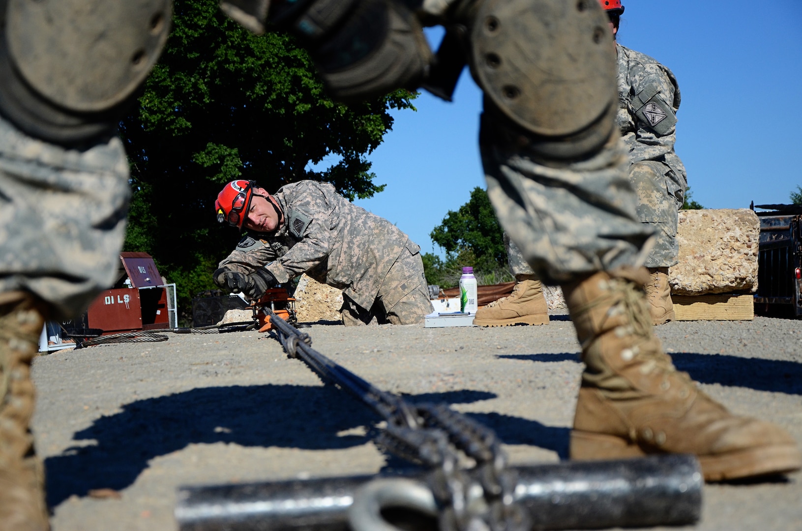 Soldiers with the Virginia Army National Guard’s Chemical, Biological, Radiological, Nuclear, High Yield Explosive Enhanced Response Force Package, or CERFP, work through a training exercise as part of the CERFP Heavy Collapse Specialist Course at Camp Gruber, Okla. The CERFP is trained in a variety of techniques in order to respond to large-scale disaster situations where urban search and rescue skills area needed.