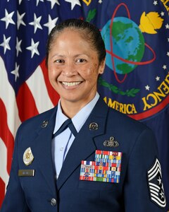 U.S. Air Force Command Chief Master Sgt. Arleen K. Heath, Defense Intelligence Agency senior enlisted advisor poses for a command photo in the U.S. Army Portrait studio at the Pentagon in Washington, D.C., Aug. 29, 2014.