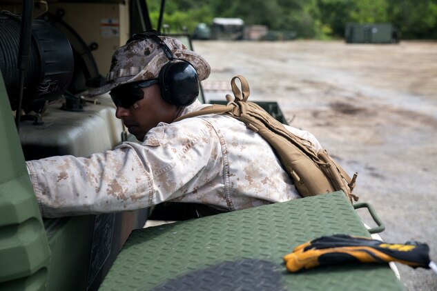 A Marine works on a generator Sept. 1 on Tinian during preparation for Exercise Valiant Shield 2014. The squadron’s mission during the exercise is to prepare an airstrip and provide support for all participating units. Valiant Shield is a biennial exercise which focuses on the integration of joint training among U.S. forces. The Marine is with Marine Wing Support Squadron 171, Marine Aircraft Group 12, 1st Marine Aircraft Wing, III Marine Expeditionary Force.