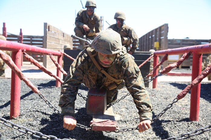 Recruit Axe T. Buffington, Platton 1003, Alpha Company, 1st Recruit Training Battalion, balances himself on a chain bridge during the 12 Stalls event at Marine Corps Base Camp Pendleton, Calif., Aug. 27.  The 12 Stalls event is a part of the Crucible, which is a 54-hour test of endurance where recruits must conquer more than 30 different obstacles while they experience food and sleep deprivation. During the Crucible, recruits utilize small unit leadership skills they’ve acquired throughout training. Buffington is a native of Princeton, Minn., and was recruited out of Recruiting Substation St. Cloud, Minn. 