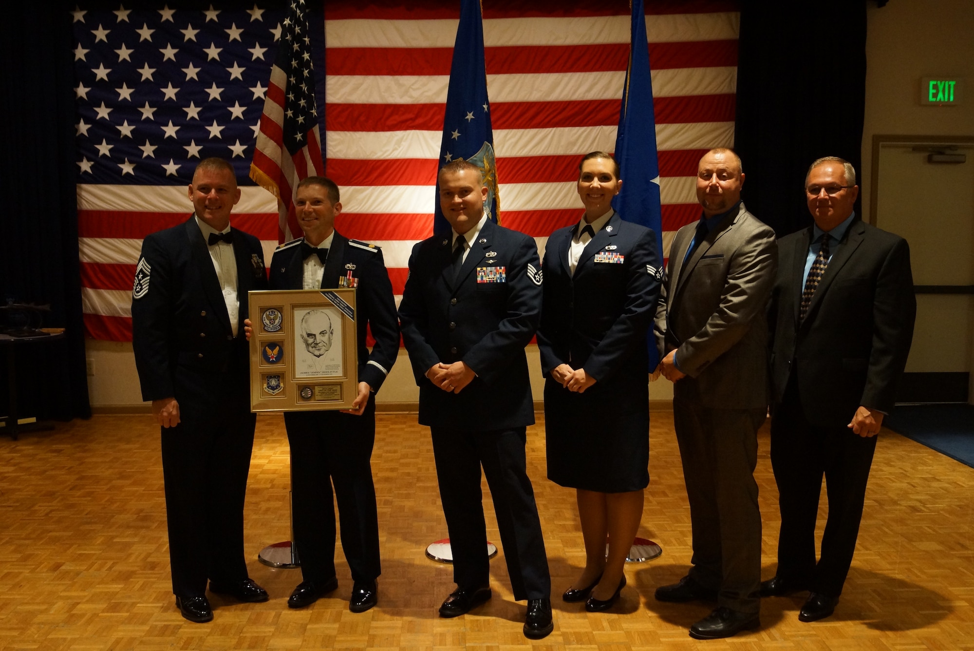 Members of the 60th Aerial Port Squadron accept the California Air Force Association Military Unit of the Year Award at Vandenberg Air Force Base, California Aug. 16, 2014. (courtesy photo)