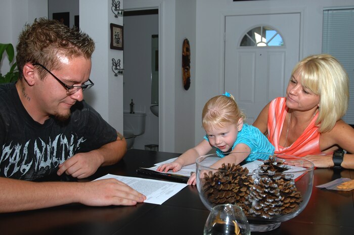 Stacy Cooper (Right), wife of Capt. Jenner Cooper, 99th Medical Group critical care resident nurse, discusses emergency awareness plans with her son Jonathan and daughter Aubrey at their home in Las Vegas Sept. 2, 2014. Emergency awareness plans cover a large range of topics like determining meeting locations, daily schedules and contact information in case of catastrophic events such as earthquakes, floods, fires, and even terror attacks. (U.S. Air Force photo by Staff Sgt. Jack Sanders)