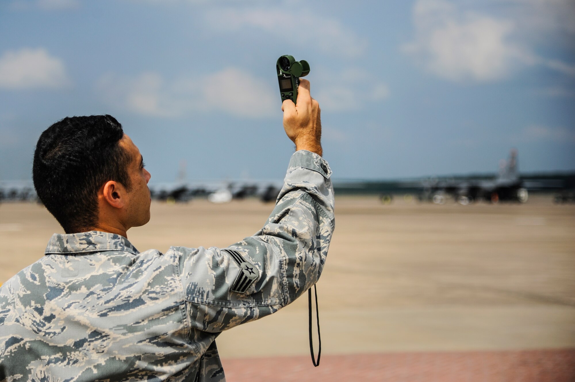 Senior Airman Robert Cantu, a 19th Operations Support Squadron weather technician, uses a kestrel while on the flightline Aug. 27, 2014, at Little Rock Air Force Base, Ark. Kestrels are used for manual observations of temperature, wind, pressure and dew points. (U.S. Air Force photo by Airman 1st Class Harry Brexel) 