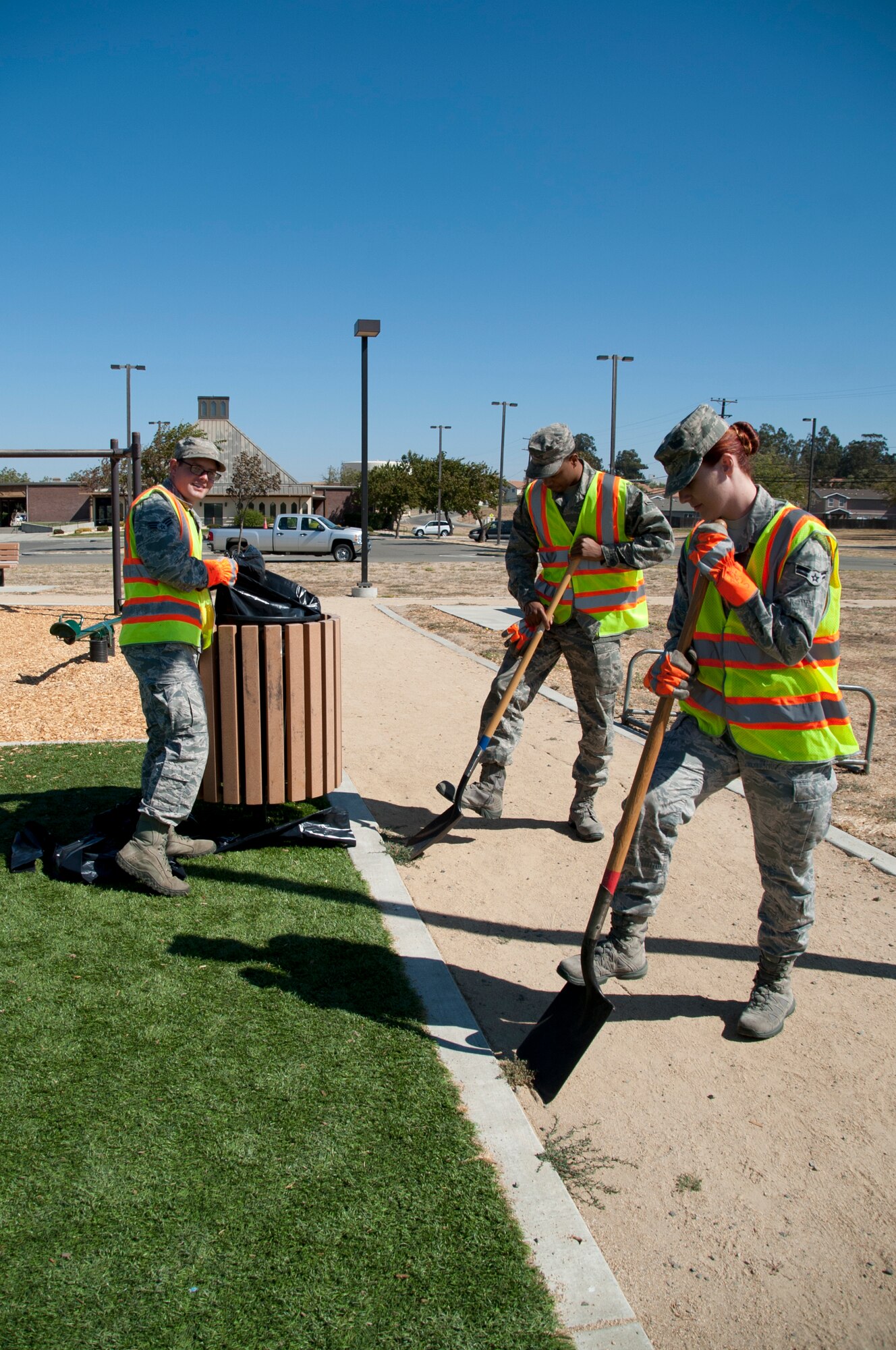 Airman 1st Class Jessica Duran, 60th Inpatient Operations Squadron mental health technician, Airman Dequan Bell, 60th Logistics Readiness Squadron warehouse technician and Senior Airman Zachary Burns, 60th Operations Support Squadron air traffic control and Base Appearance Team apprentice, beautify the Travisville Park September 2 at Travis Air Force Base. Keeping Travis clean of debris is a big job for the eight Airmen team of volunteers at the BAT. (U.S. Air Force photo by Airman 1st Class Amber Carter)