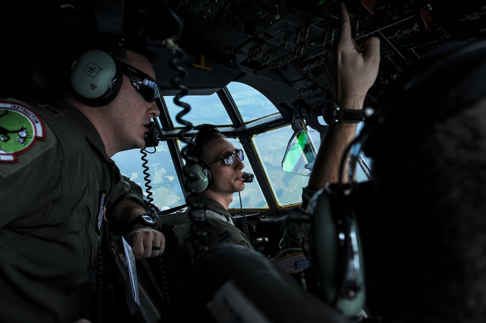 Pilots from the 41st Airlift Squadron perform a training mission Aug. 7, 2014, at Little Rock Air Force Base, Ark. These Airmen were part of a two-ship formation, which is a tactical element made of up two aircraft. (U.S. Air Force photo by Airman 1st Class Cliffton Dolezal)