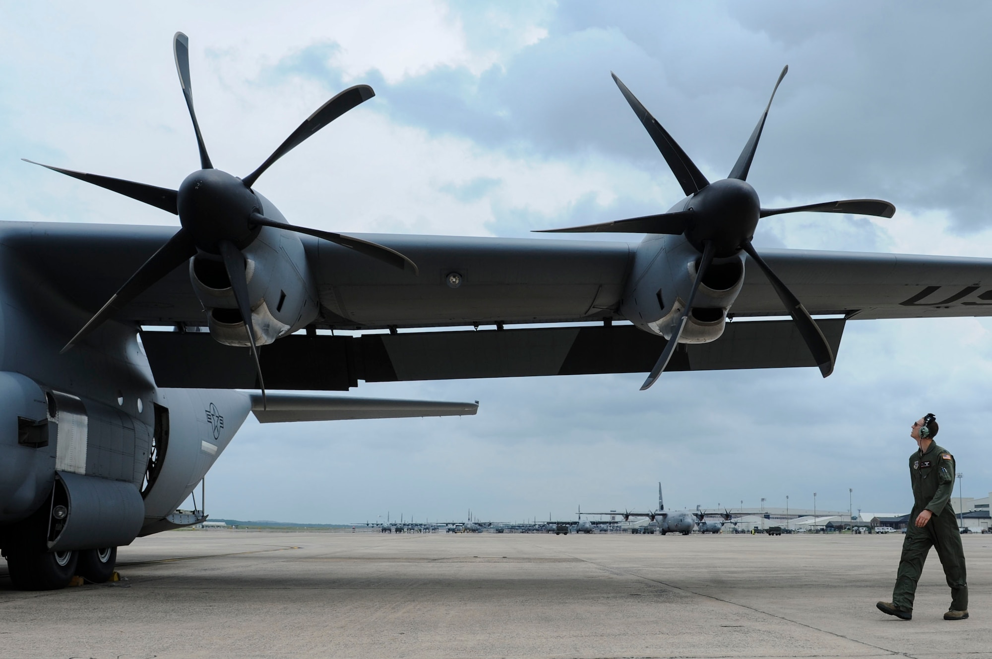 Capt. Brian Boardman, a 41st Airlift Squadron C-130J pilot, completes a walk-around of his C-130J prior to starting the aircraft Aug. 7, 2014, at Little Rock Air Force Base, Ark. The inspection was part of routine checks to assess aircraft conditions before and after every flight. (U.S. Air Force photo by Airman 1st Class Cliffton Dolezal)