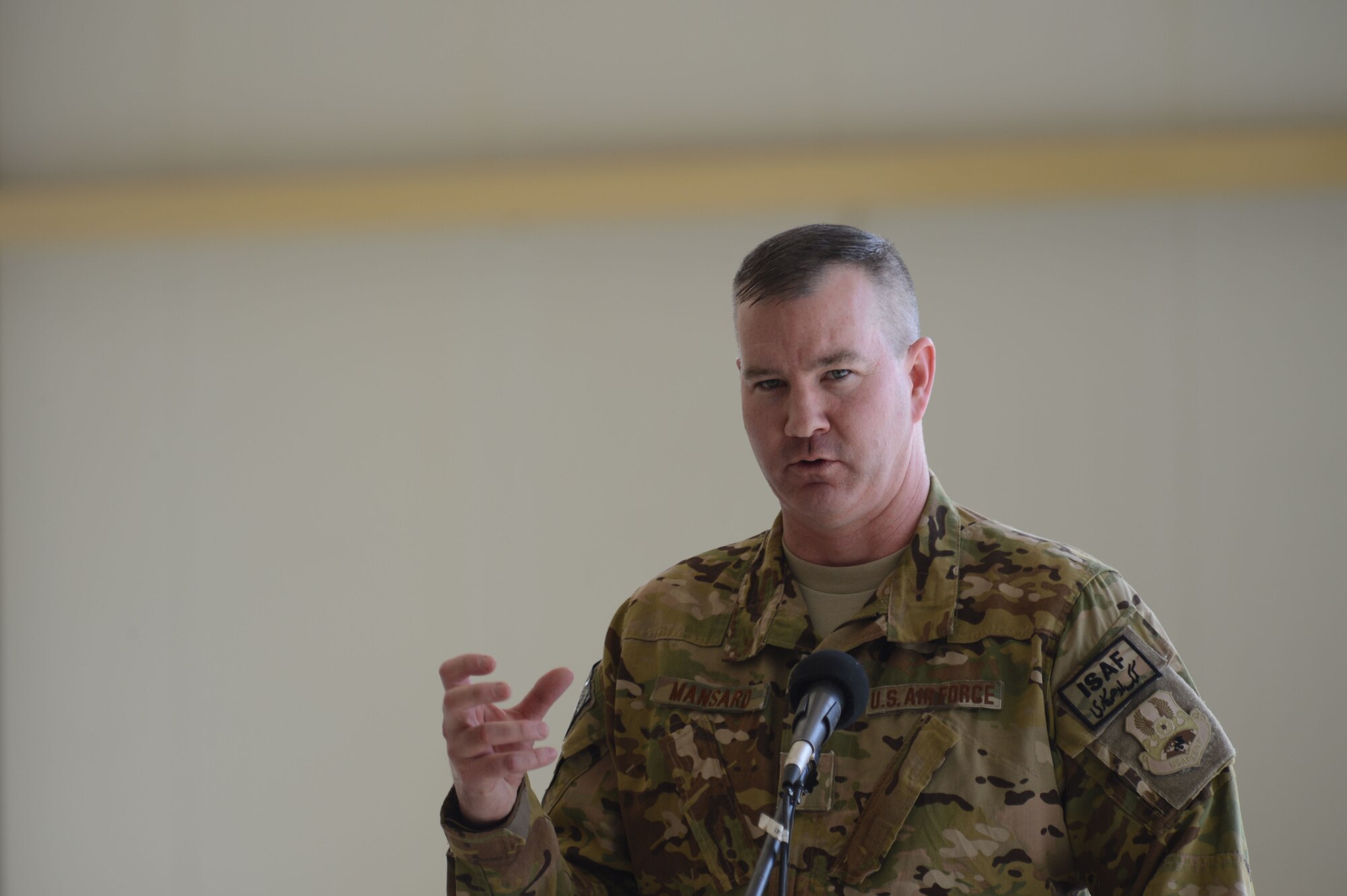 U.S. Air Force Lt. Col. James Mansard, 361st Expeditionary Reconnaissance Squadron commander makes a few remarks on the successes of the past and current members of the 361st Expeditionary Reconnaissance Squadron to attendees during the 361 ERS deactivation ceremony Sept. 1, 2014 at Kandahar Airfield, Afghanistan. The 361 ERS was responsible for providing over watch for Regional Command-South and was responsible for scanning 57,000 kilometers of land, 700 convoys, 190 vehicle interdictions, 150 drug caches, 320 weapons caches and the removal of 890 enemies off the battlefield. Mansard, a native of San Diego and is deployed from Beale Air Force Base, California.(U.S. Air Force photo by Master Sgt. Cohen A. Young/Released)