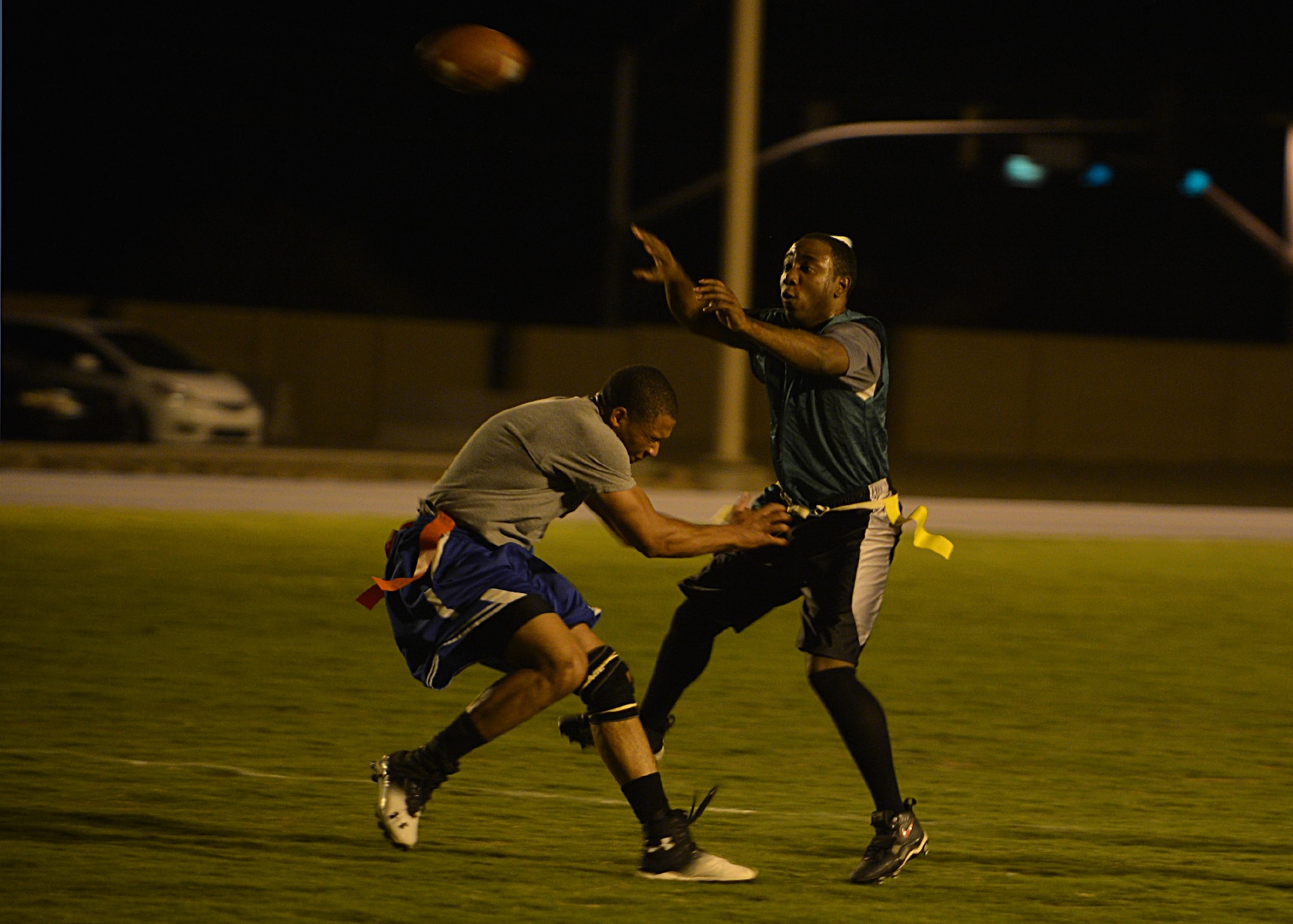 Allen Dismuke, 56th Comptroller Squadron, throws the football Aug. 18 during the intramural football game against Detachment 12, 372nd Training Squadron at Luke Air Force Base. The 372nd TRS defeated FWSA 12-0. (U.S. Air Force photo/Senior Airman Grace Lee)