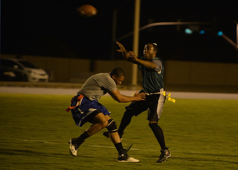Allen Dismuke, 56th Comptroller Squadron, throws the football Aug. 18 during the intramural football game against Detachment 12, 372nd Training Squadron at Luke Air Force Base. The 372nd TRS defeated FWSA 12-0. (U.S. Air Force photo/Senior Airman Grace Lee)