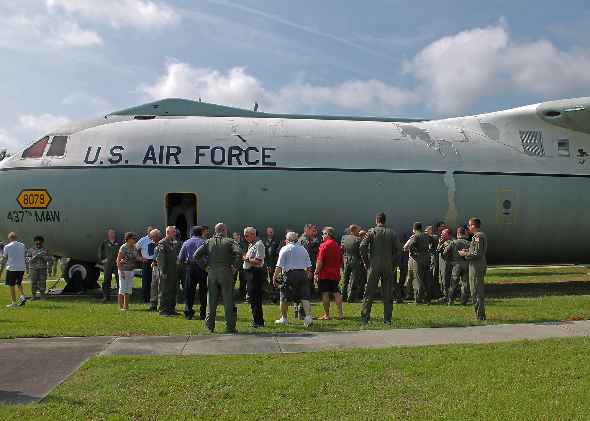 Attendees of a 701st Airlift Squadron during a remembrance ceremony in the Joint Base Charleston heritage air park tour a C-141 Starlifter. The 701st AS unveiled a memorial placard honoring nine fallen 701st Military Airlift Squadron Airmen who died when their C-141  crashed 30 years ago on July 12, 1984. (Courtesy photo)