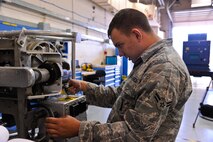 Airman 1st Class Robert Hawkins, 341st Maintenance Operation Squadron power, refrigeration, and electrical technician, performs a hardware inspection of guidance missile maintenance platform equipment during a training session at Malmstrom Air Force Base’s 3-Bay Hangar Aug. 19. Every nut, bolt and washer must be checked to ensure the hardware will function properly. (U.S. Air Force photo/Airman 1st Class Collin Schmidt)