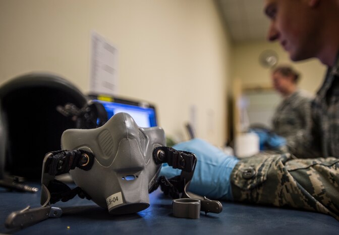 437th Operations Support Squadron aircrew flight equipment technicians work on a wide range of items including parachutes, night vision goggles, helmets and even breathing apparatuses for aircrew members on C-17A Globemaster IIIs at Joint Base Charleston, S.C. (U.S. Air Force photo/Senior Airman Dennis Sloan)