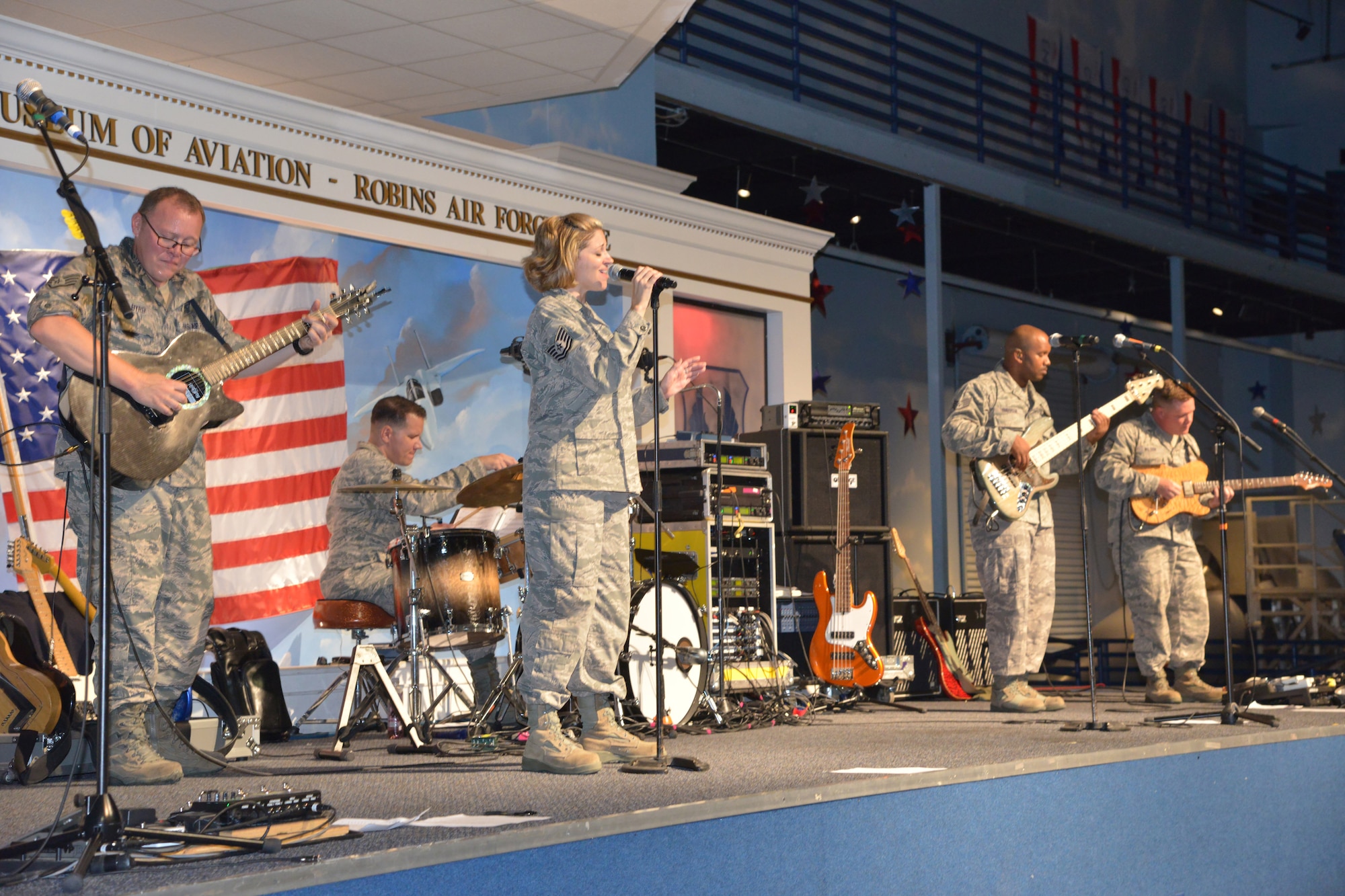 A little bad weather didn’t stop Middle Georgia music lovers from coming out for a few free tunes. Members of Sky Country performed for more than 160 people at the Museum of Aviation September 3, 2014. Sky Country is the newest ensemble of the U.S. Air Force Band of the West from Joint Base San Antonio-Lackland, Texas. Two of the musicians, Staff Sgt. Jason Byrd, a guitarist, and Staff Sgt. Andy Wendzikowski, a drummer, are former members of the Band of the Air Force Reserve which was deactivated at Robins due to Air Force budget cuts. The concert, originally scheduled for September 2, was postponed due to inclement weather and a power outage. (U.S. Air Force photo by Ray Crayton)