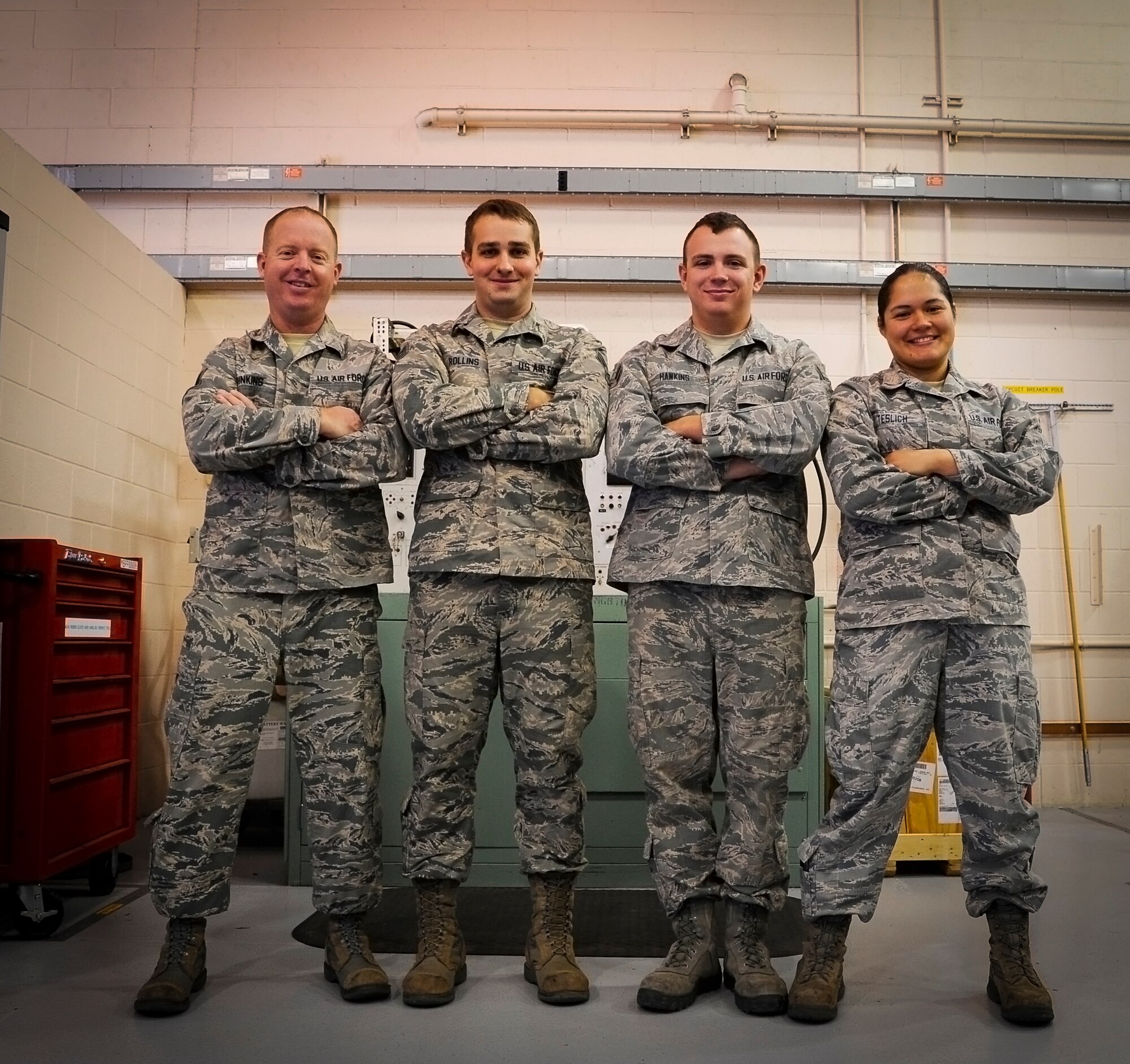 (From left to right) Tech. Sgt. Brian Dinkins, Senior Airman Justin Rollins, Airman 1st Class Robert Hawkins and Senior Airman Nancy Teslich, 341st Maintenance Operations Squadron power, refrigeration, and electrical section team, pose for a photograph after a training session at Malmstrom’s 3-Bay Hangar Aug. 19. The team is one of nine from Malmstrom Air Force Base that will be competing in the 2014 Air Force Global Strike Challenge. (U.S. Air Force photo/Airman 1st Class Collin Schmidt)