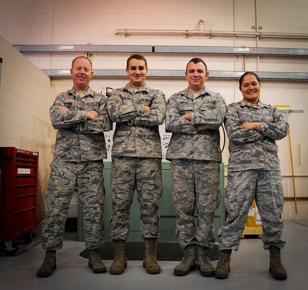 (From left to right) Tech. Sgt. Brian Dinkins, Senior Airman Justin Rollins, Airman 1st Class Robert Hawkins and Senior Airman Nancy Teslich, 341st Maintenance Operations Squadron power, refrigeration, and electrical section team, pose for a photograph after a training session at Malmstrom’s 3-Bay Hangar Aug. 19. The team is one of nine from Malmstrom Air Force Base that will be competing in the 2014 Air Force Global Strike Challenge. (U.S. Air Force photo/Airman 1st Class Collin Schmidt)