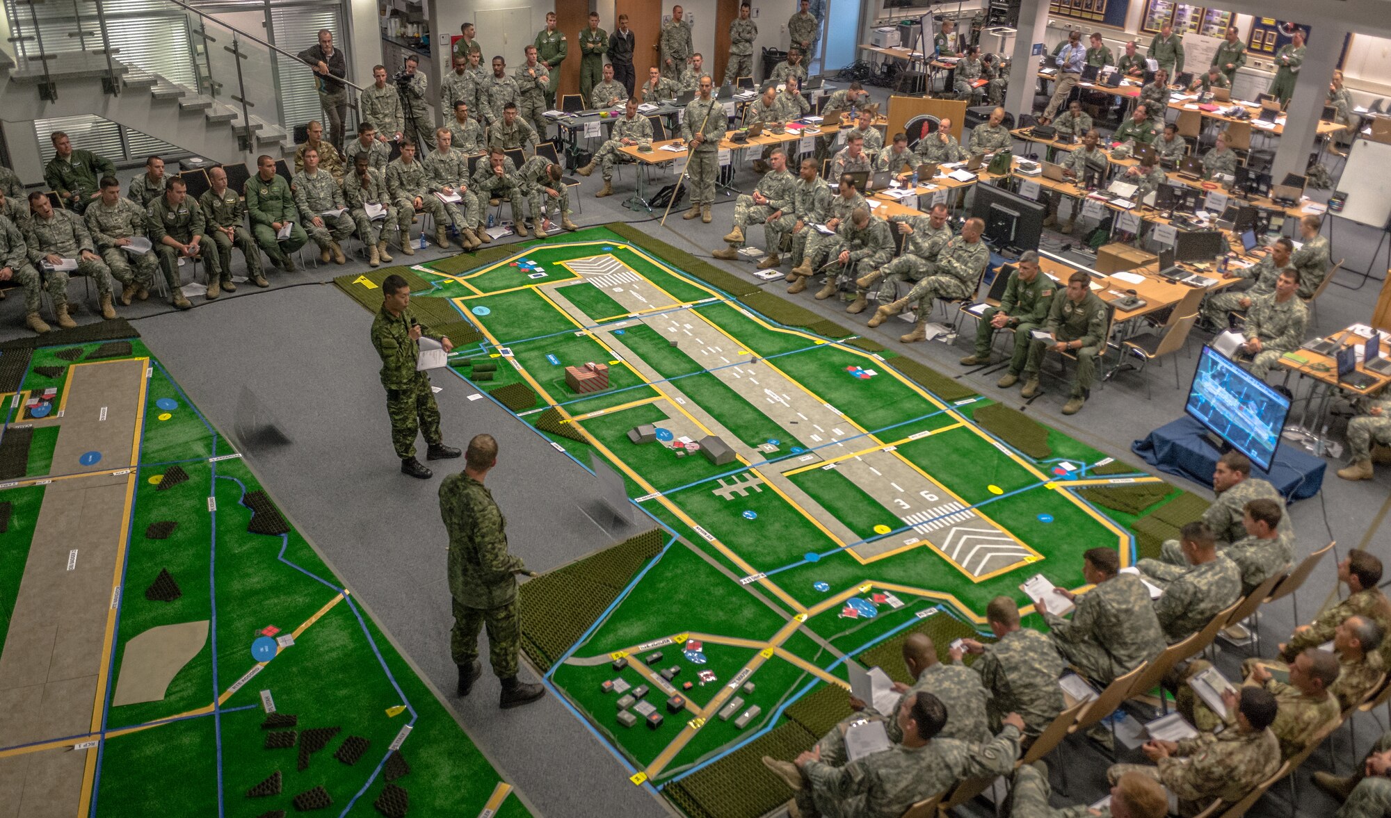 U.S. Army Col. Michael Foster, 173rd Airborne Brigade commander briefs all those in attendance about the importance and impact of exercise Steadfast Javelin II on Ramstein Air Base, Germany, Sept. 4, 2014. The exercise sustains interoperability between NATO Allies and Partnership for Peace partner nation forces. The interoperability has been gained during combat and multinational contingency operations over the past seven decades, while focusing on building capacity for the current and future operational environment. (U.S. Air Force photo/Airman 1st Class Jordan Castelan)