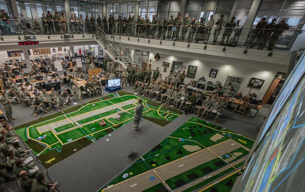 U.S. Army Col. Michael Foster, 173rd Airborne Brigade commander briefs all those in attendance about the importance and impact of exercise Steadfast Javelin II on Ramstein Air Base, Germany, Sept. 4, 2014. The exercise sustains interoperability between NATO Allies and Partnership for Peace partner nation forces. The interoperability has been gained during combat and multinational contingency operations over the past seven decades, while focusing on building capacity for the current and future operational environment. (U.S. Air Force photo/Airman 1st Class Jordan Castelan)