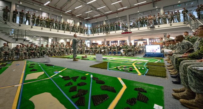 U.S. Army Col. Michael Foster, 173rd Airborne Brigade commander briefs all those in attendance about the importance and impact of exercise Steadfast Javelin II on Ramstein Air Base, Germany, Sept. 4, 2014. The exercise prepares U.S., NATO Allies and European security partners to conduct unified land operations through the simultaneous combination of offensive, defensive, and stability operations appropriate to the mission and the environment and to sustain interoperability with partner nations. (U.S. Air Force photo/Airman 1st Class Jordan Castelan)