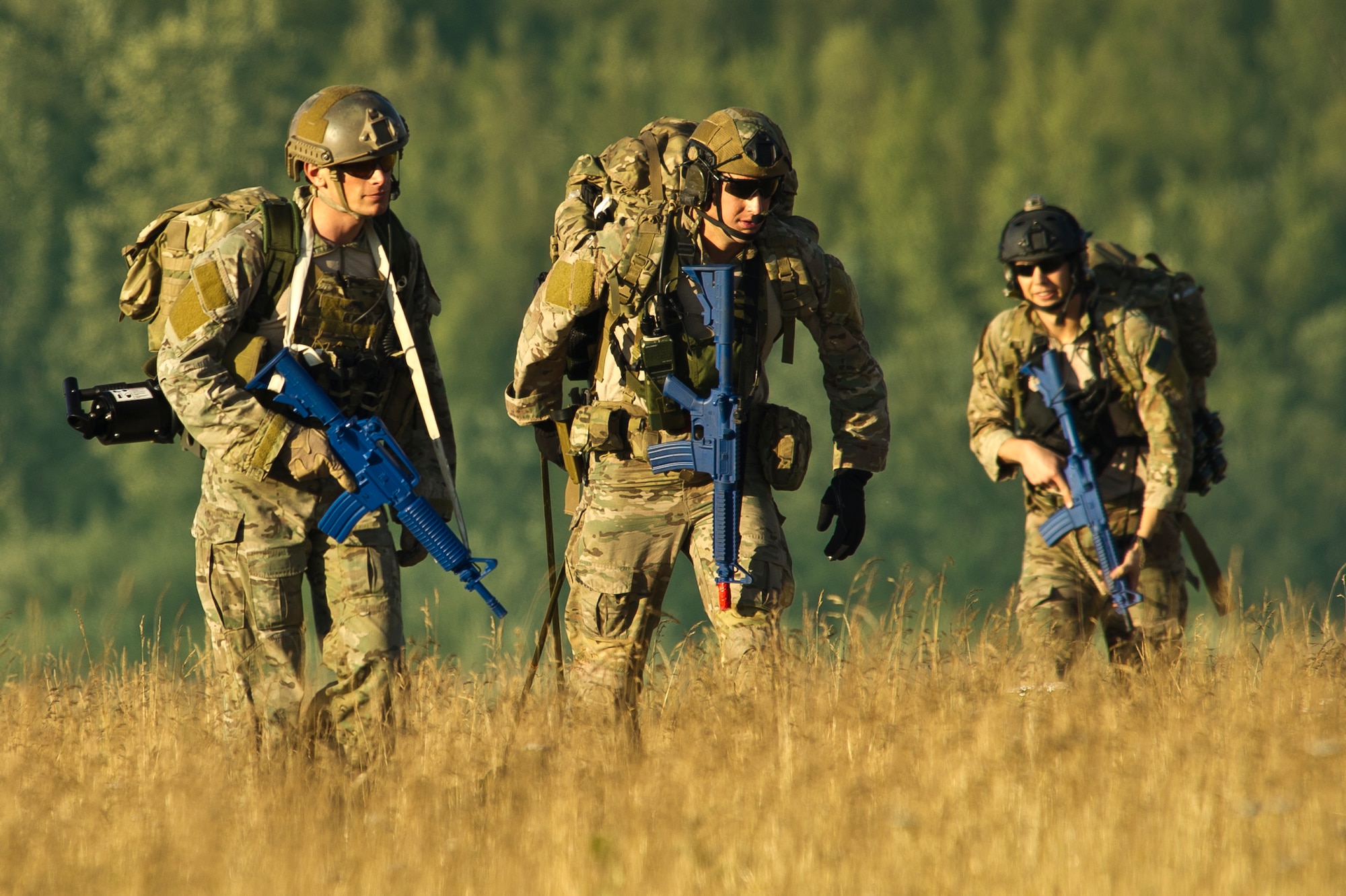 U.S. Air Force pararescuemen also known as PJs (para-jumpers) from the, Alaska Air National Guard Joint Base Elmendorf-Richardson, Alaska and PJs from the (Pararescue/Guardian Angels) Davis-Monthan AFB, Ariz., assess the scene during simulated mass casualty combat training scenario upon arrival at the drop zone / air field July 30, 2014. The PJs are responsible for providing emergency and lifesaving services to military personnel and civilians in both peacetime and combat environments. They go behind enemy lines before anyone and help call in fire support.