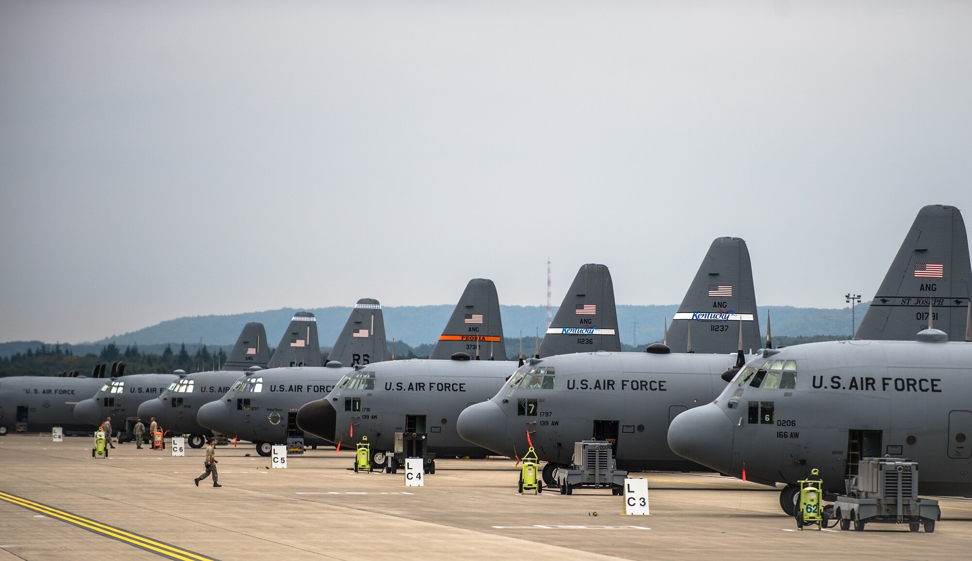 C-130s from the Air National Guard wait on the Ramstein Air Base flightline, Germany, Sept. 3, 2014, just days before they'll be loaded up with Army and Air Force paratroopers to support the Steadfast Javelin II exercise. Steadfast Javelin II is a NATO-led exercise involving more than 2,000 service members from several nations, and takes place across Estonia, Germany, Latvia, Lithuania and Poland. The exercise focuses on increasing interoperability and synchronizing complex operations between allied air and ground forces through airborne and air-assault missions. (U.S. Air Force photo/ Airman 1st Class Jordan Castelan)