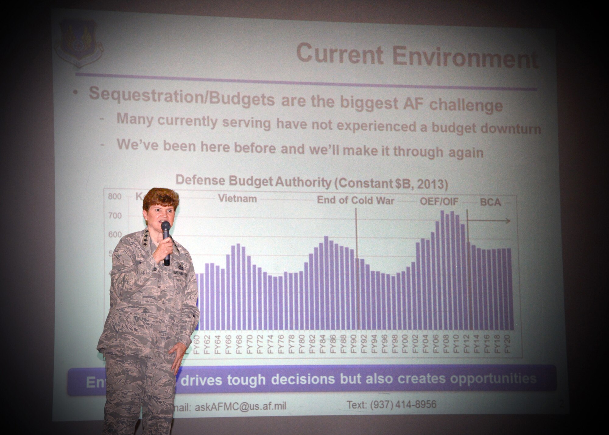 Gen. Janet Wolfenbarger, commander of Air Force Materiel Command, speaks to Team Tinker military and civilian members during an  Aug. 26 all call at the base auditorium. The general discussed several challenges facing the Air Force today, including sequestration and a constrained budget environment.  (Air Force photo by Kelly White)