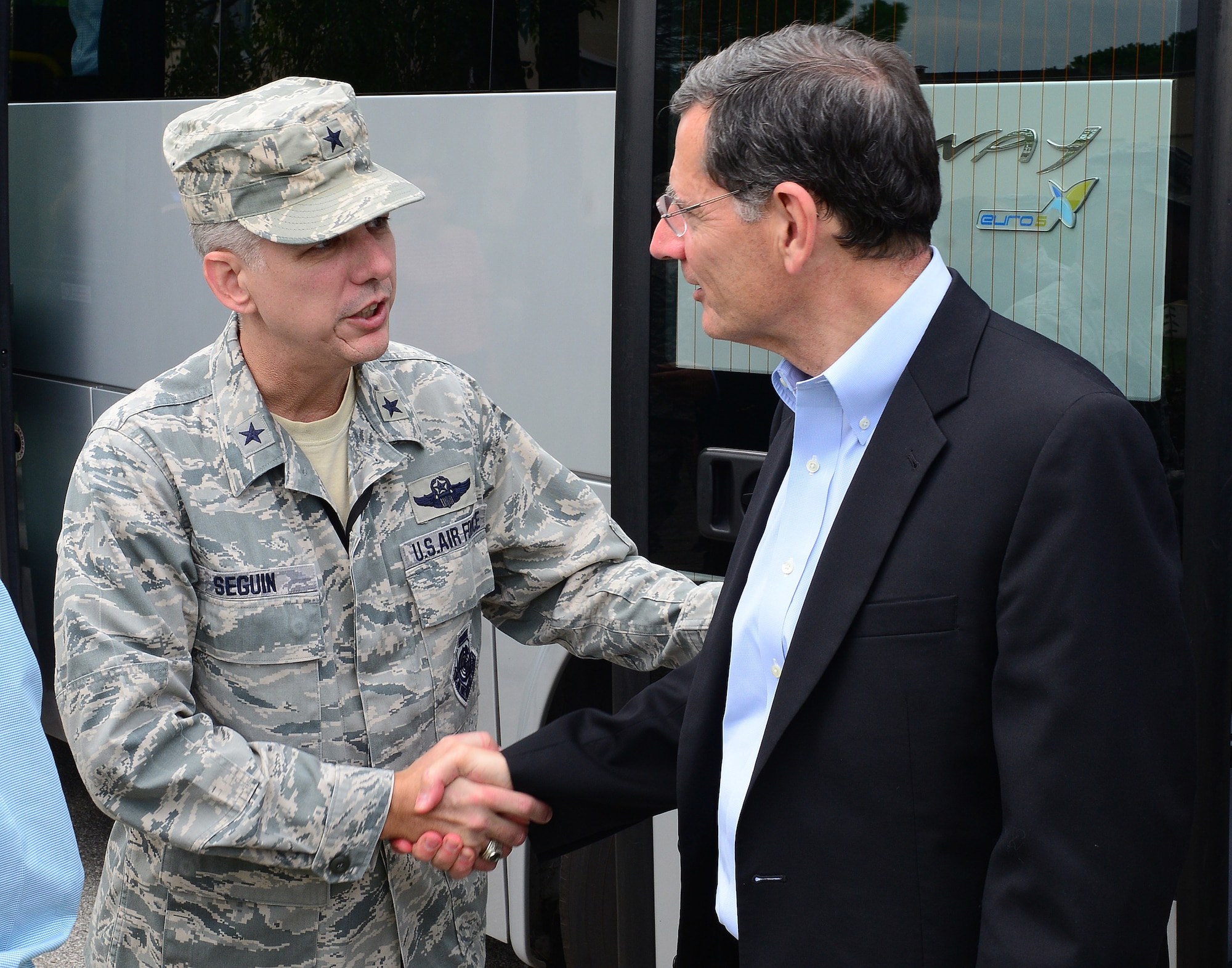 Brig. Gen. Barre Seguin, 31st Fighter Wing commander, shakes hands with Wyoming senator John Barrasso, Sept. 4, 2014, at Aviano Air Base, Italy. The senators, hailing from Georgia, North Carolina, Wyoming, West Virginia, Indiana and South Carolina, also took time to meet with Airmen from their respective states during a special luncheon. (U.S. Air Force photo/Senior Airman Matthew Lotz)