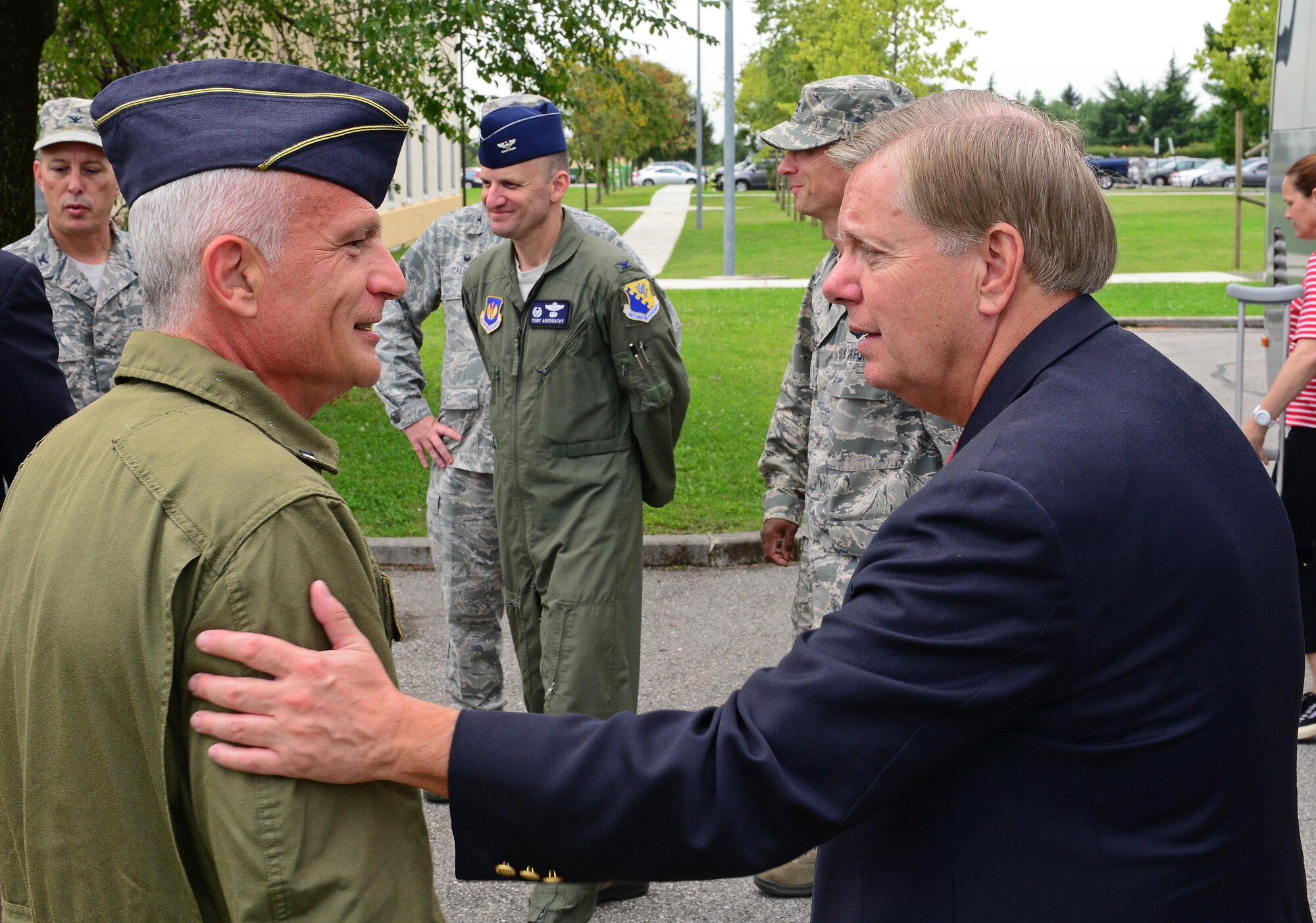 South Carolina Senator Lindsey Graham greets Col. Valentino Savoldi, Italian air force “Pagliano e Gori” Airport commander, Sept. 4, 2014, at Aviano Air Base, Italy. Graham is the only senator to still serve in the military as part of the U.S. Air Force Reserves. A colonel, he serves as a senior instructor at the Air Force Judge Advocate General School, Maxwell Air Force Base, Ala. (U.S. Air Force photo/Senior Airman Matthew Lotz)