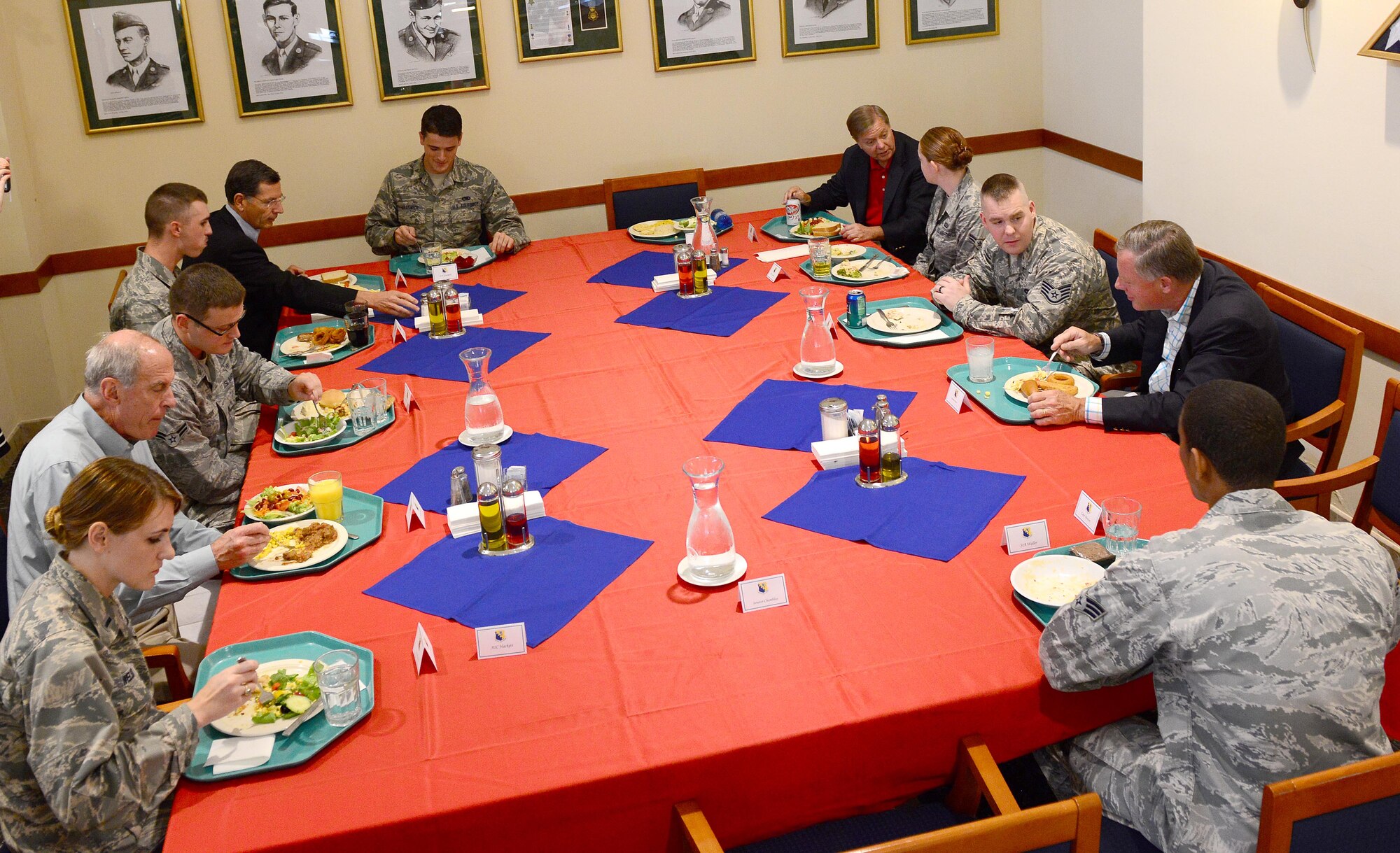 U.S. Senators have lunch with Airmen from the 31st Fighter Wing, Sept. 4, 2014, at Aviano Air Base, Italy. For each of the five senators that visited the base, two Airmen were selected from their home state to meet and have lunch with them. (U.S. Air Force photo/Senior Airman Matthew Lotz)
