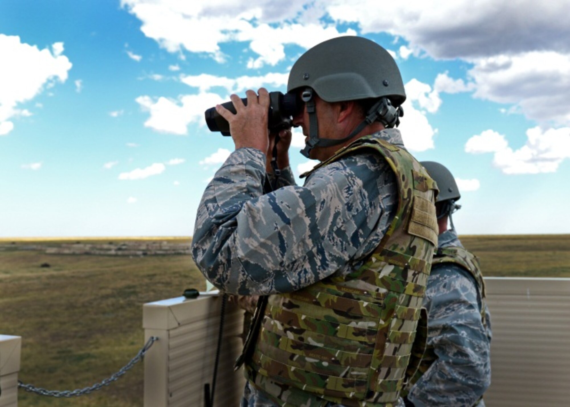 U.S. Air Force Lt. Gen. Brad Heithold, Air Force Special Operations Command commander, surveys the landscape during a tour Sept. 3, 2014 at Melrose Air Force Range, N.M. Heithold, who recently took command of AFSOC, toured the base and connected with Airmen to become better acquainted with the 27th Special Operations Wing, its personnel and capabilities. (U.S. Air Force photo/Airman 1st Class Shelby Kay-Fantozzi)