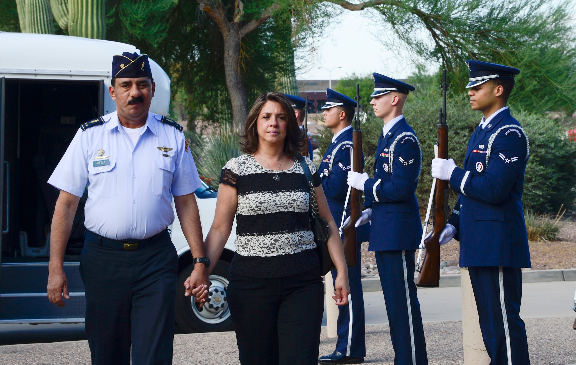 Brig. Gen. Carlos Mena, Chief of Staff of the El Salvadorian air force, and his wife Maria Mena walk through an honor cordon at 12th Air Force (Air Forces Southern), Davis-Monthan Air Force Base, Ariz., Sept. 3, 2014.  The El Salvadorian delegation was invited to visit AFSOUTH this week to discuss upcoming U.S. and El Salvadorian political-military integration subject matter expert exchanges. (USAF photo by Tech. Sgt. Heather R. Redman/Released) 