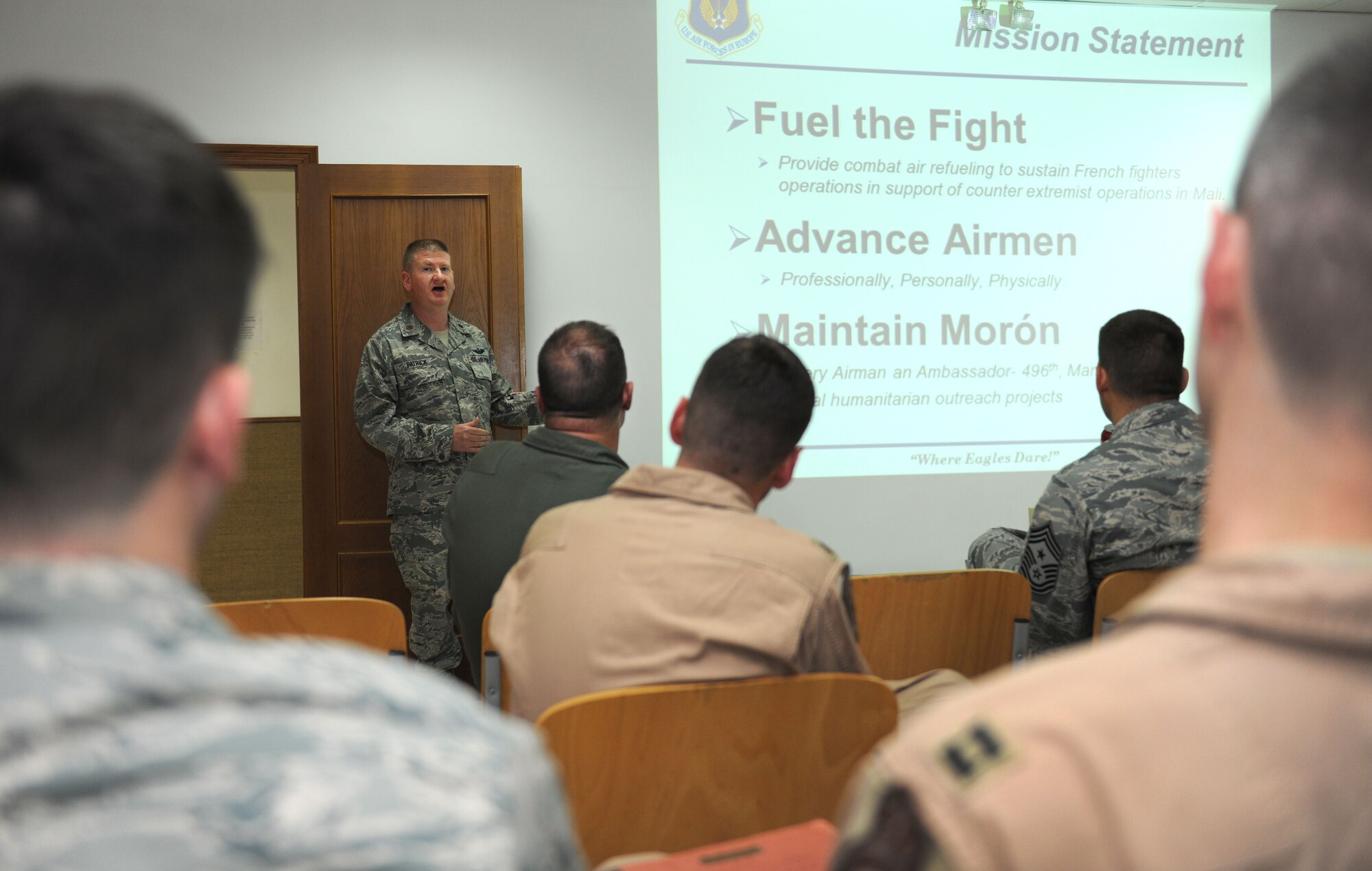Airmen from the 100th Air Refueling Wing attend an in-prossessing brief upon their arrival during a tail swap Aug. 27, 2014, on Moron Air Base, Spain. Aircrew and mainteance Airmen assigned to the 100th ARW perform tail swaps reguarly, which refers to when tail numbers on aircraft paperwork are literally swapped and those Airmen who are deployed to Moron AB return home, helping promote higher morale and mission effectiveness. (U.S. Air Force photo/Senior Airman Kate Maurer/Released)