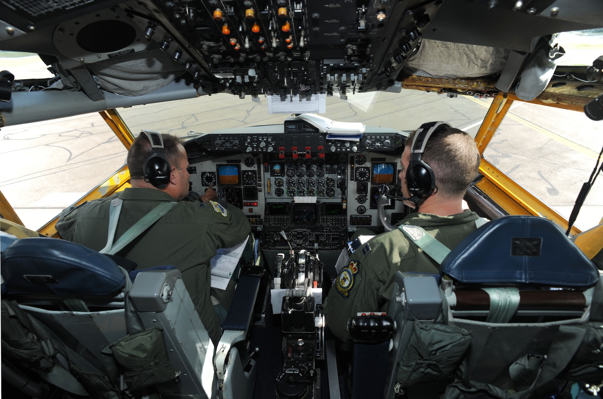 U.S. Air Force Col. Kenneth T. Bibb, Jr., left, 100th Air Refueling Wing commander and KC-135 Stratotanker pilot, and U.S. Air Force Capt. Justin Skinner, 351st Air Refueling Squadron pilot from Choctaw, Okla., perform their preflight checklist before a flight to Moron Air Base, Spain, Aug. 27, 2014, on RAF Mildenhall, England. Bibb is qualified as a command pilot with more than 4,500 flight hours and tries to fly whenever his schedule as a wing commander allows. (U.S. Air Force photo/Senior Airman Kate Maurer/Released)
