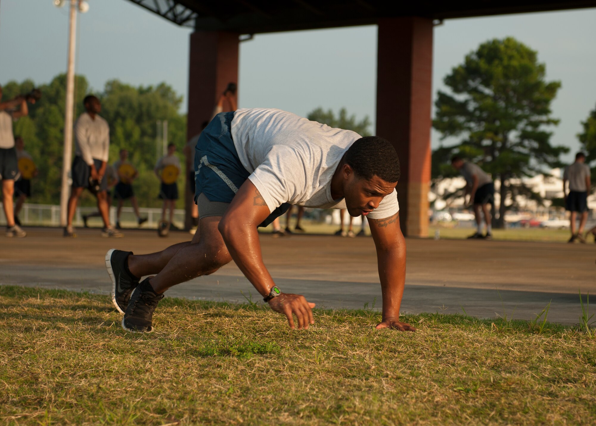 Senior Airman Dallas Starks, a 19th Communications Squadron enterprise information management technician, bear crawls during squadron physical training Aug. 27, 2014, at Little Rock Air Force Base, Ark. Squadron PT is not just for the physical training. It also increases morale and encourages team building. (U.S. Air Force photo by Airman 1st Class Scott Poe) 