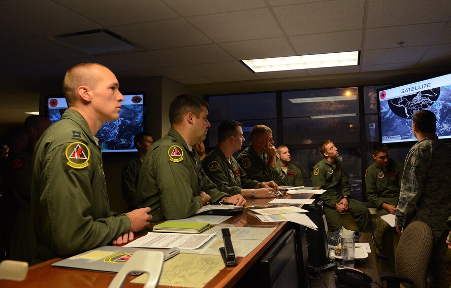 Aircrews from the 96th Bomb Squadron receive their weather briefing on Barksdale Air Force Base, La., Sept. 3, 2014. Aircrew from the 96th BS and support staff from the 2nd Bomb Wing deployed to Andersen Air Force Base, Guam, in support of the continuous bomber presence in the Pacific region. (U.S. Air Force photo/Senior Airman Benjamin Gonsier)