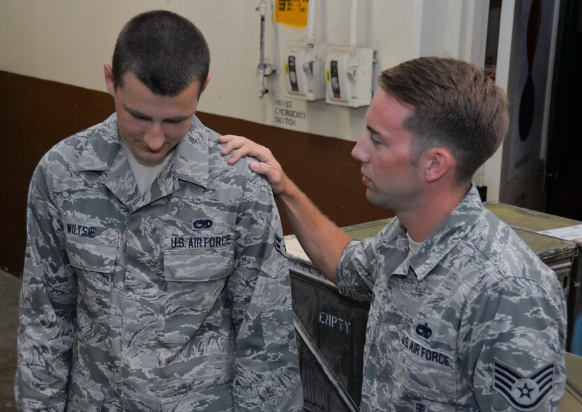Staff. Sgt. Troy Kiel, 2nd Munitions Squadron munitions storage supervisor, talks to Airman 1st Class Billy Wiltsie, 2nd Munitions Squadron munitions storage crewmember, about counseling services available on Barksdale Air Force Base, La., Sept. 2, 2014. Suicide Prevention and Awareness Month aims to prevent as many unnecessary deaths as possible caused by risk factors such as a history of mental illness, legal and financial issues, hopelessness, relationship problems and a lack of social support. ( U.S. Air Force photo/Airman 1st Class Mozer Da Cunha)