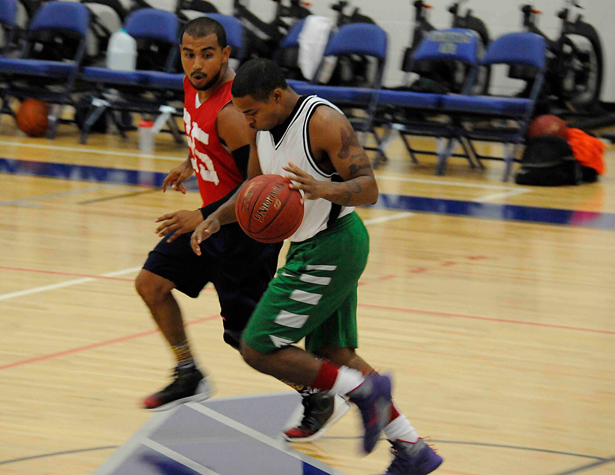 Players at Homestead Air Reserve Base, Fla., race down the basketball court during an intramural sports game at the Sam Johnson Fitness Center 14 Aug.  The intramural sports are played for recreational purposes but maintain a competitive edge. (U.S Air Force photo/Senior Airman Aja Heiden)